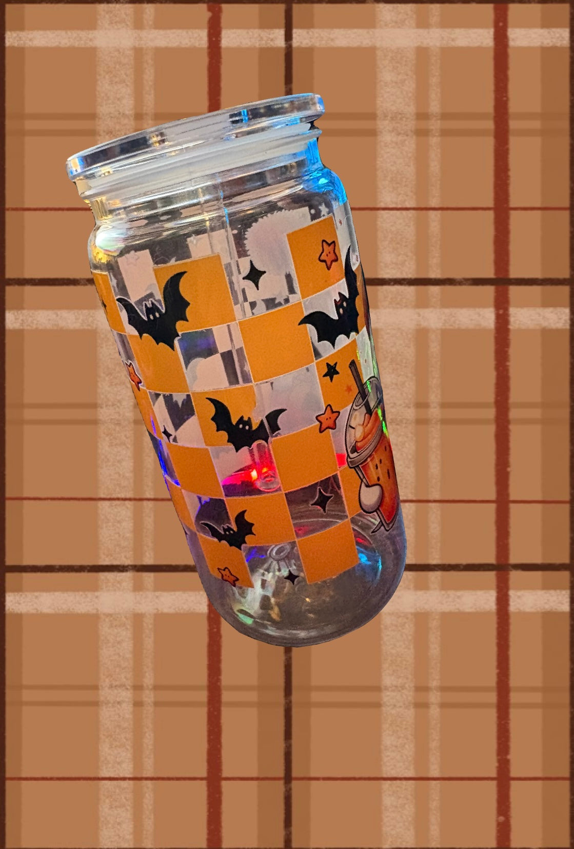 Plastic cup with Ghost cup wrap with a slight imperfection